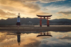 woman-enjoying-the-sunset-on-itsukushima-island-or-2022-03-08-01-18-50-utc.jpg